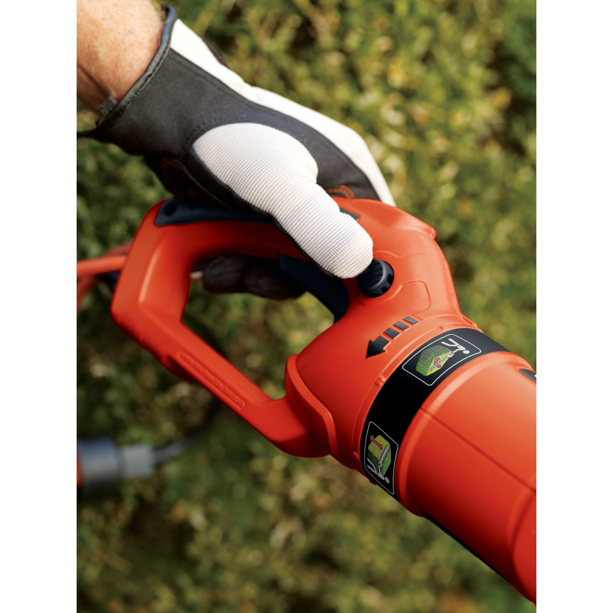 Lock button feature of 24 inch Hedge Trimmer with Rotating Handle.