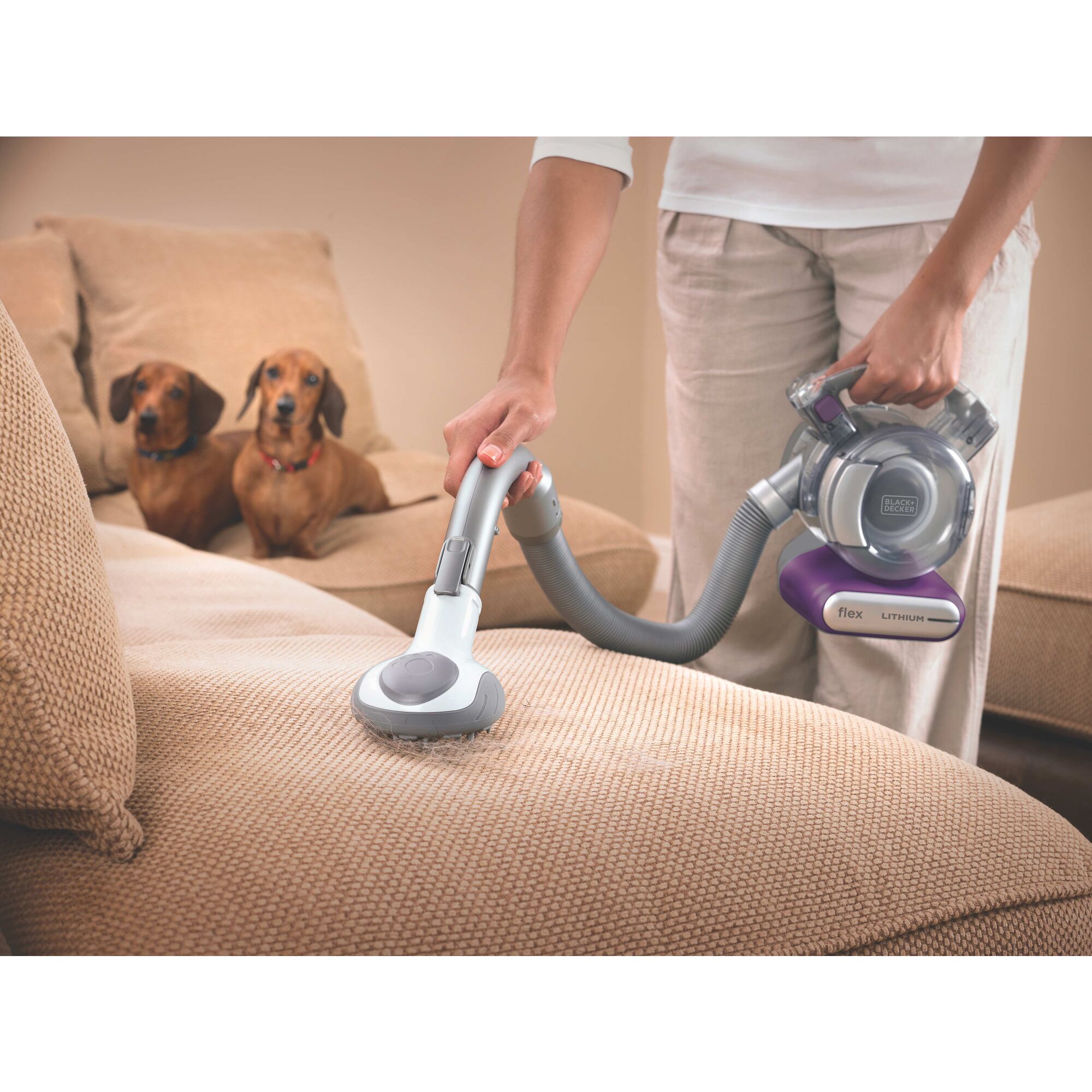 Dustbuster flex cordless hand vacuum cleaning sofa.