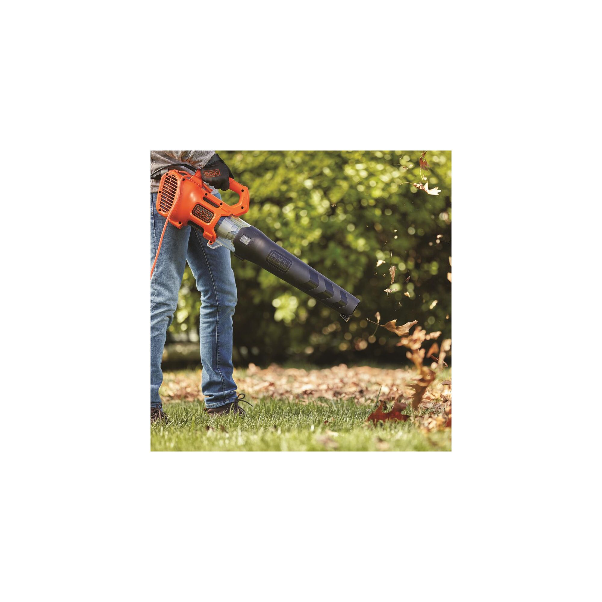 Electric axial leaf blower clearing debris.
