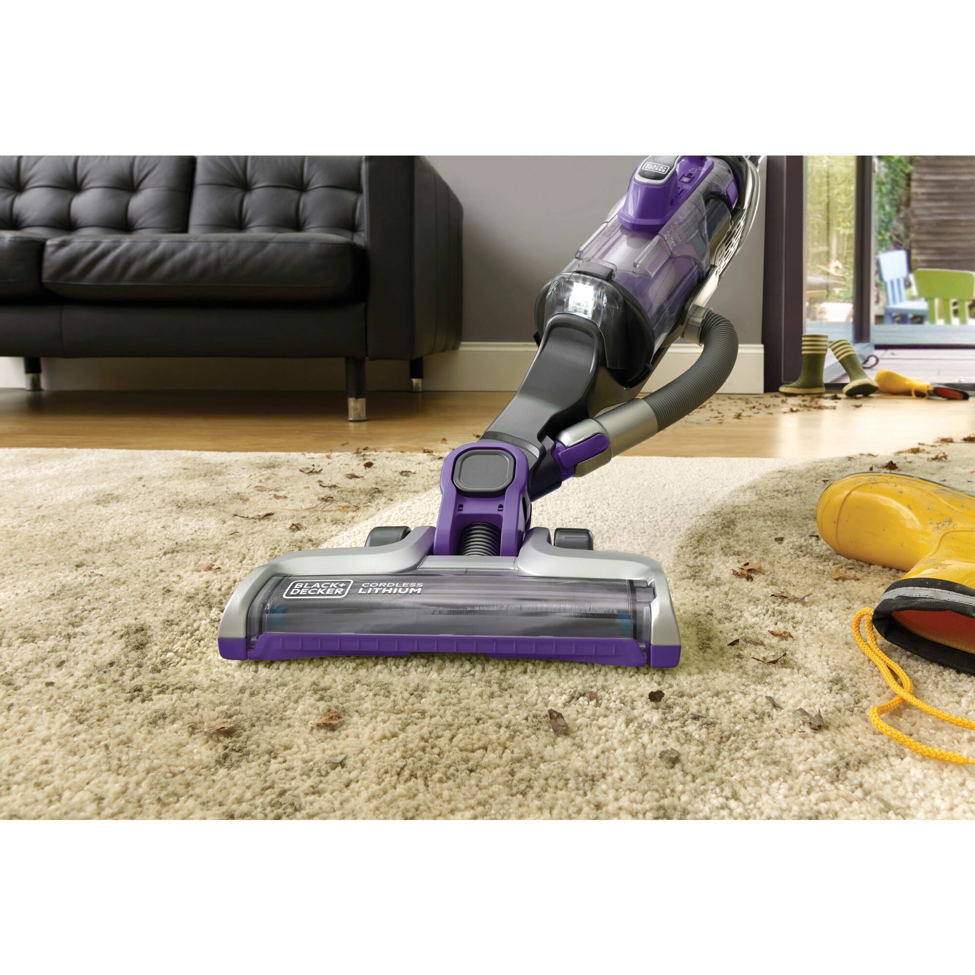 POWER SERIES PRO Cordless 2 in 1 Pet Vacuum being used to clean pet hair from rug.