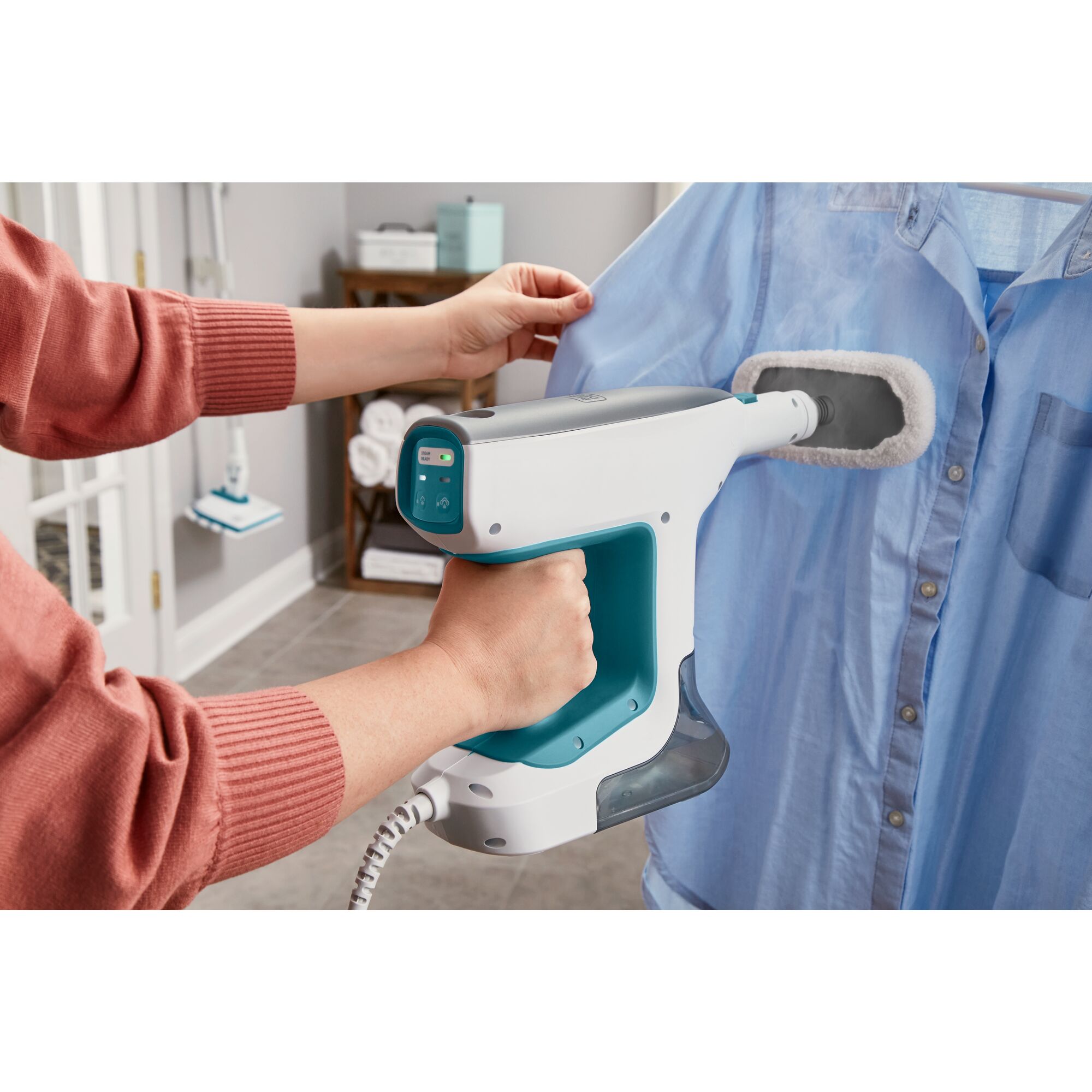 Person steaming a shirt with the BHSM15FX10 garment steamer attachment