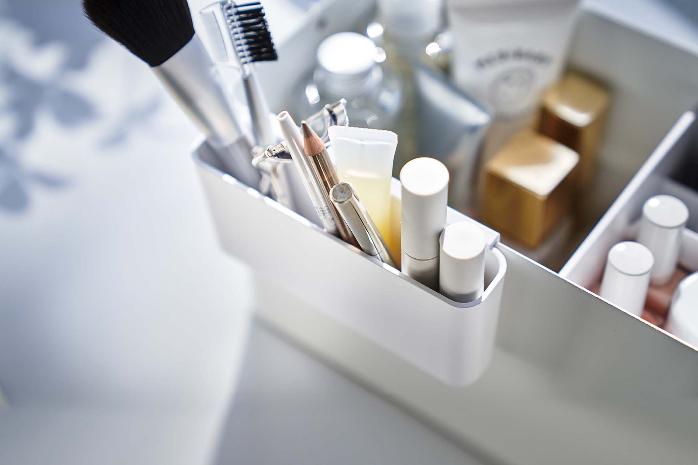 Close up of adjustable makeup rack of white Makeup Organizer with Mirror