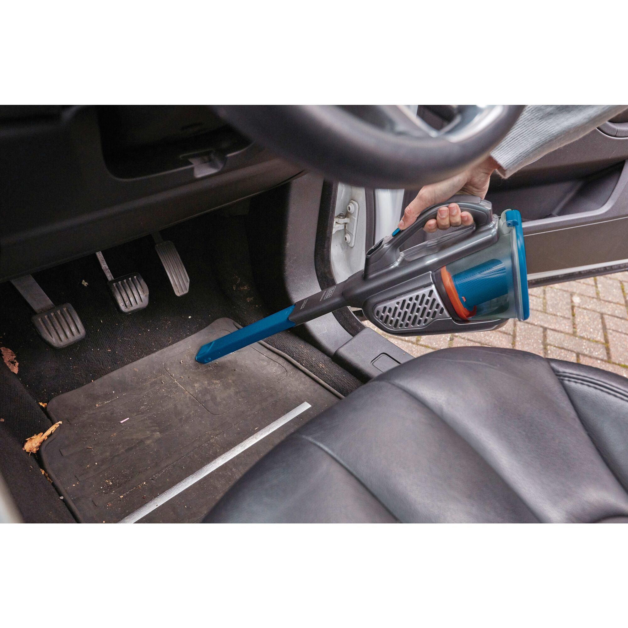 dust buster Advanced Clean plus Cordless Hand Vacuum being used to clean car floor.