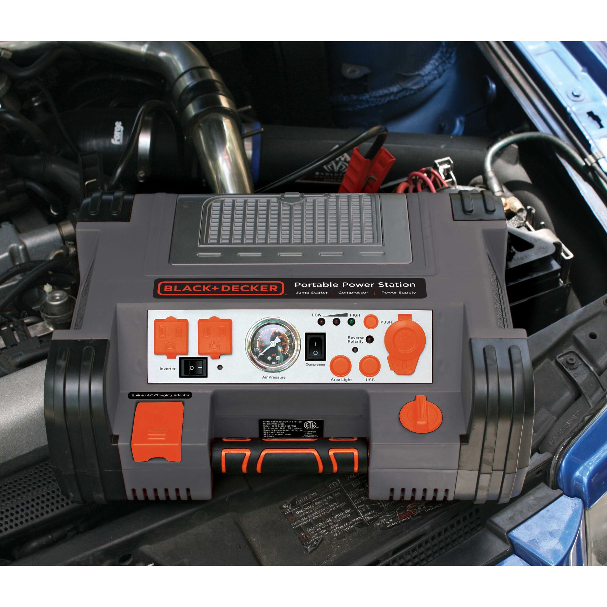 Battery Charger and Maintainer being connected to car battery using clamps.