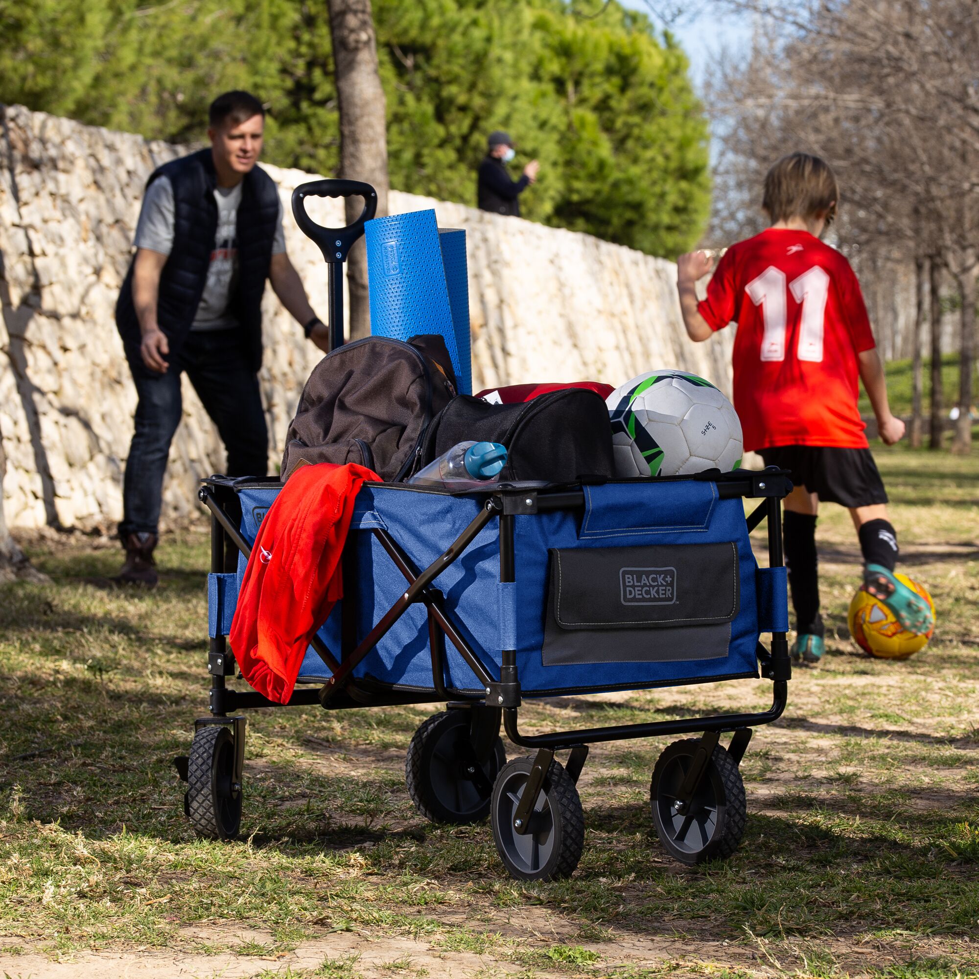 Utility wagon folding or collapsible blue holding personal items.