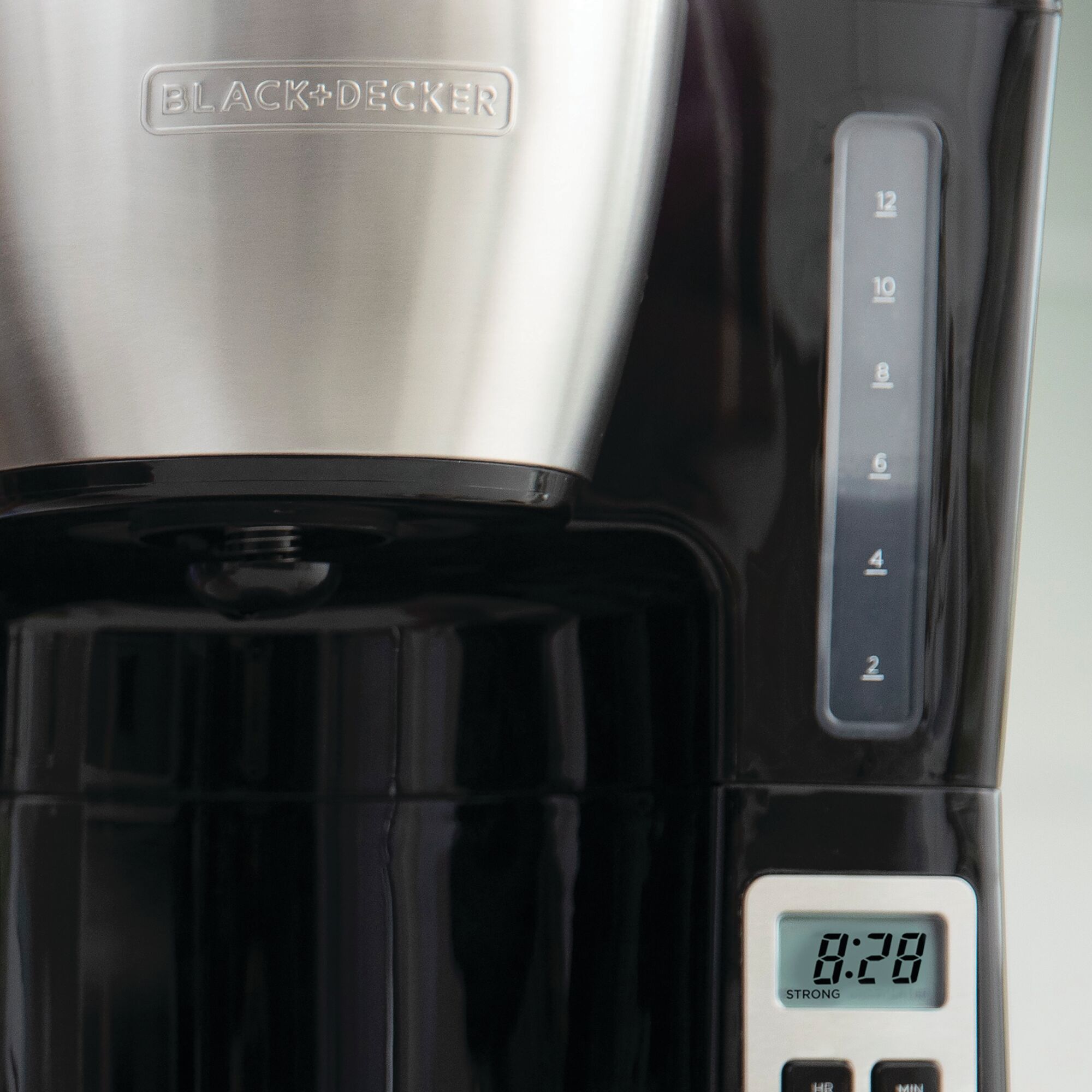Close-in image of the water level guide and digital display of the BLACK+DECKER coffee maker