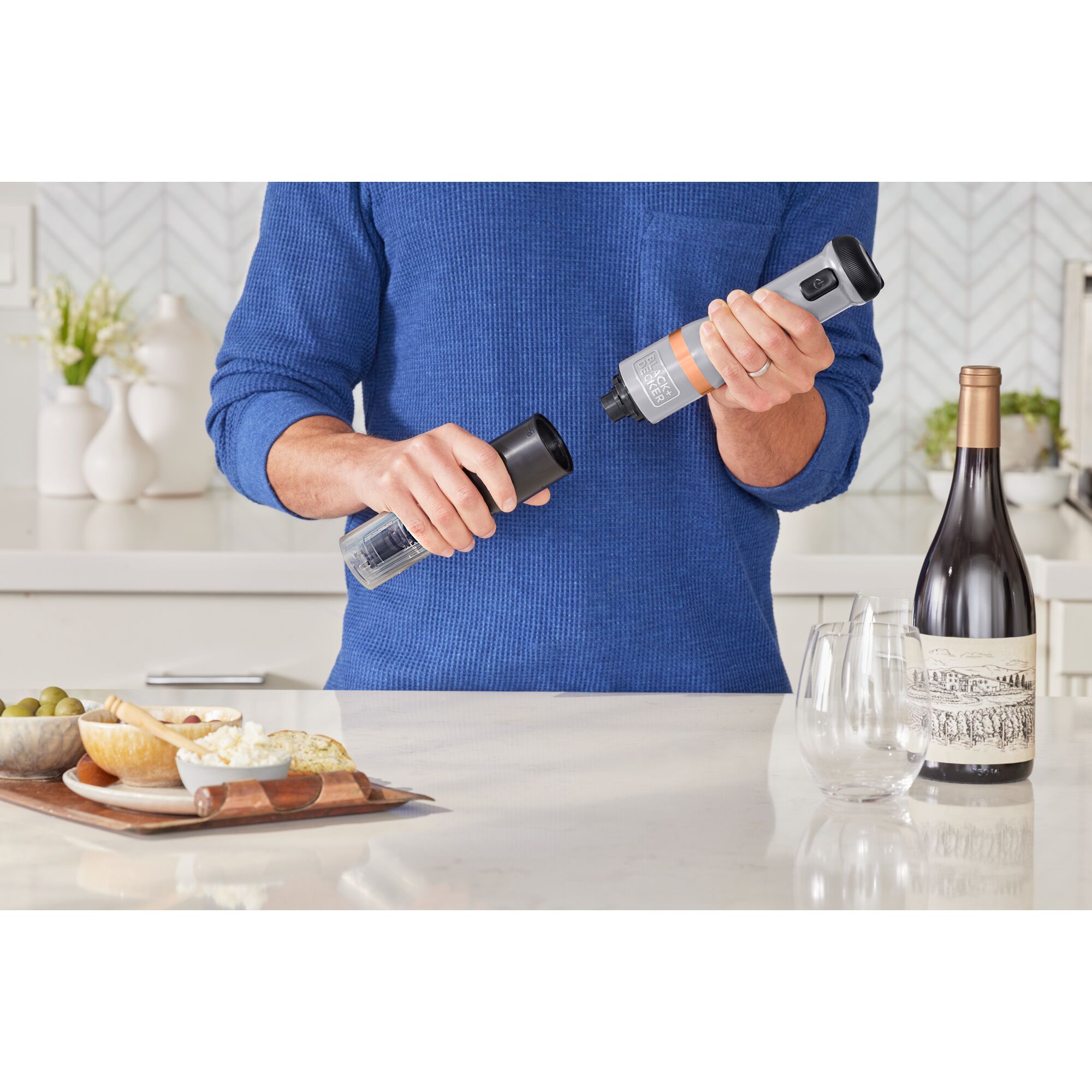 Talent showing how to attach the BLACK+DECKER kitchen wand wine opener attachment to the grey power unit