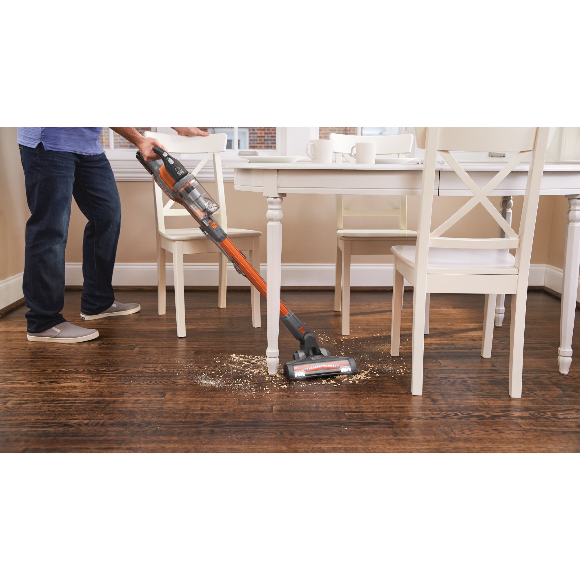 POWERSERIES™ Extreme™ Cordless Stick Vacuum Cleaner cleaning under table on hardwood floors