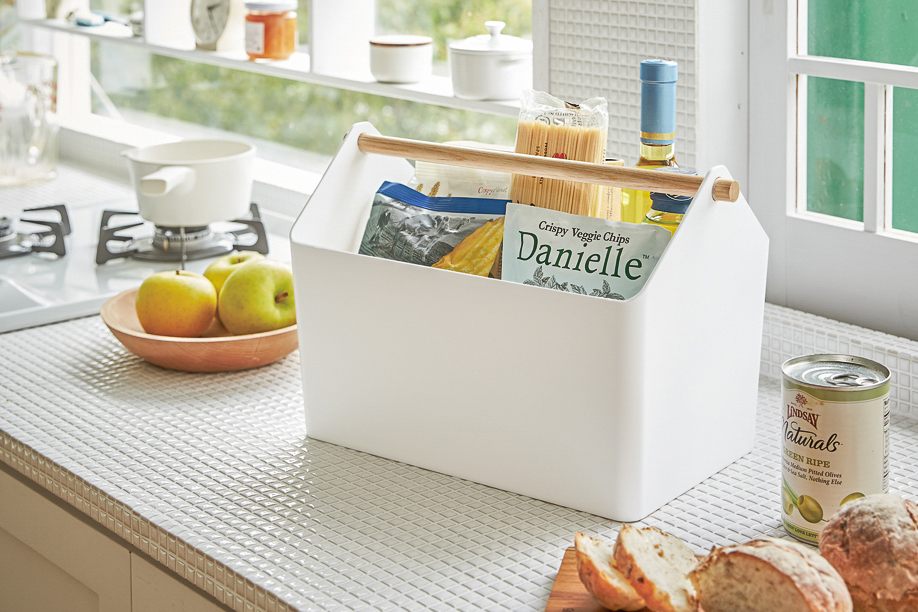 Yamazaki Home white Storage Caddy holding food items on kitchen countertop. 