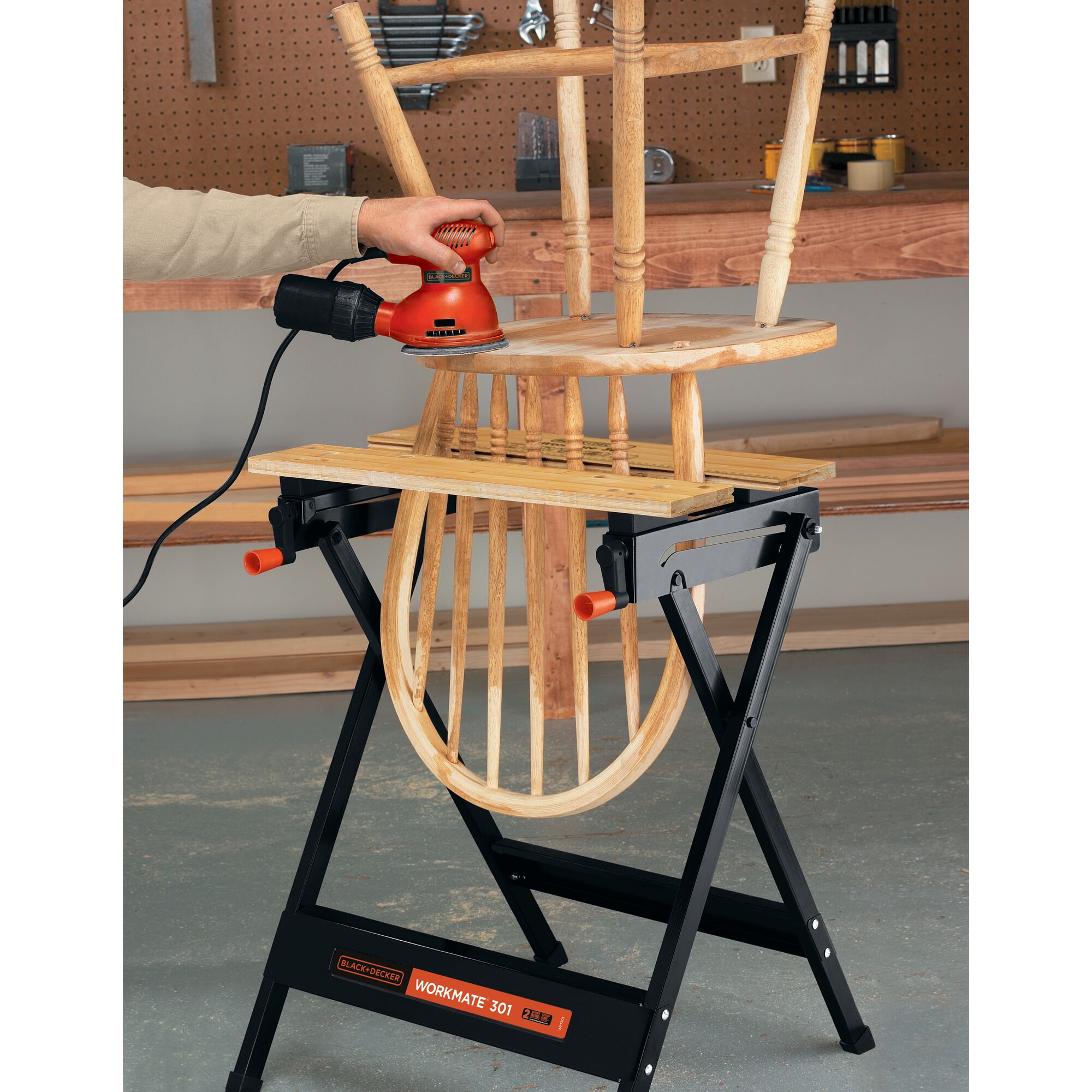 Workmate Portable Project Center and Vise being used to work on a wooden chair by a person.