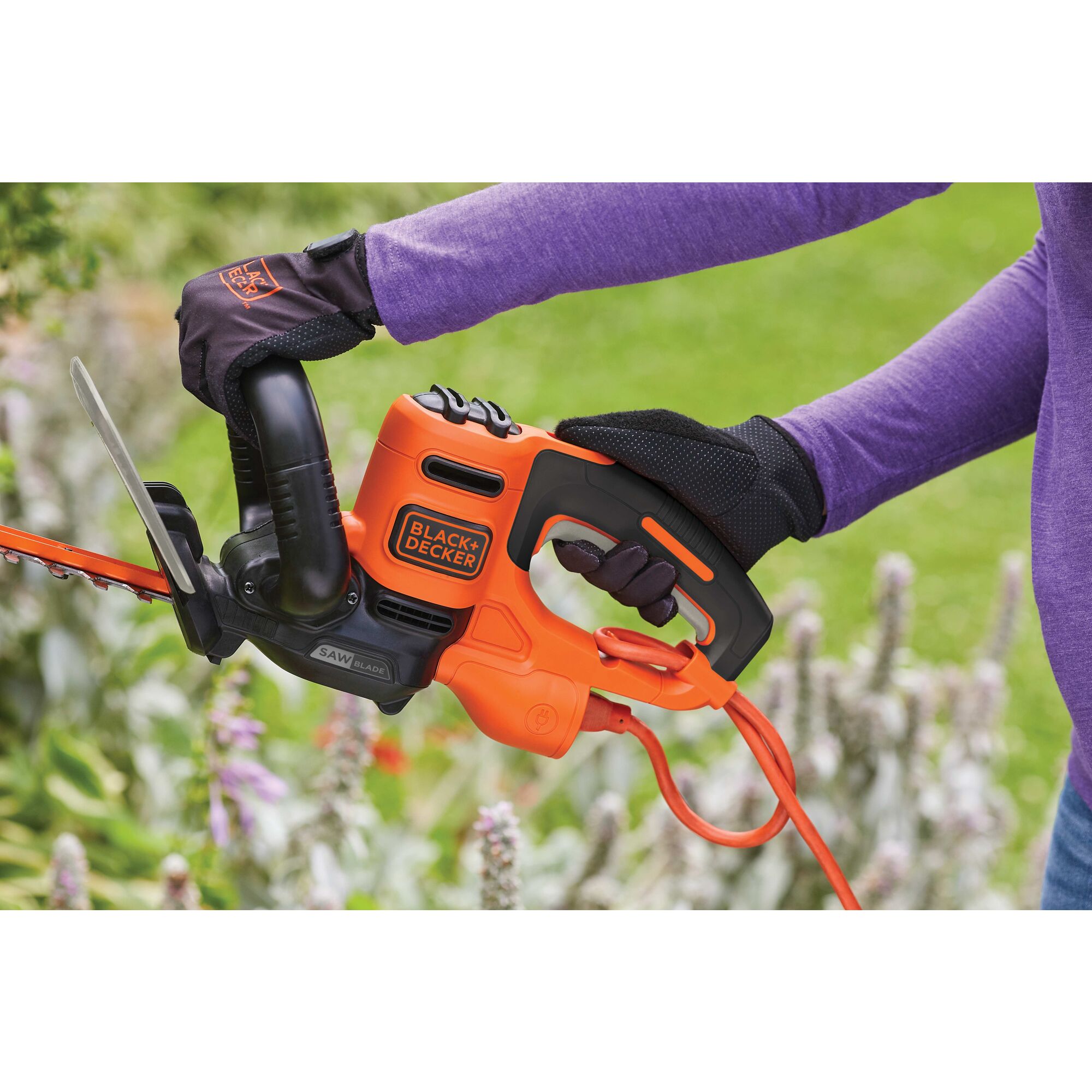 Full wrap around front handle feature of 22 inch SAW BLADE Electric Hedge Trimmer.