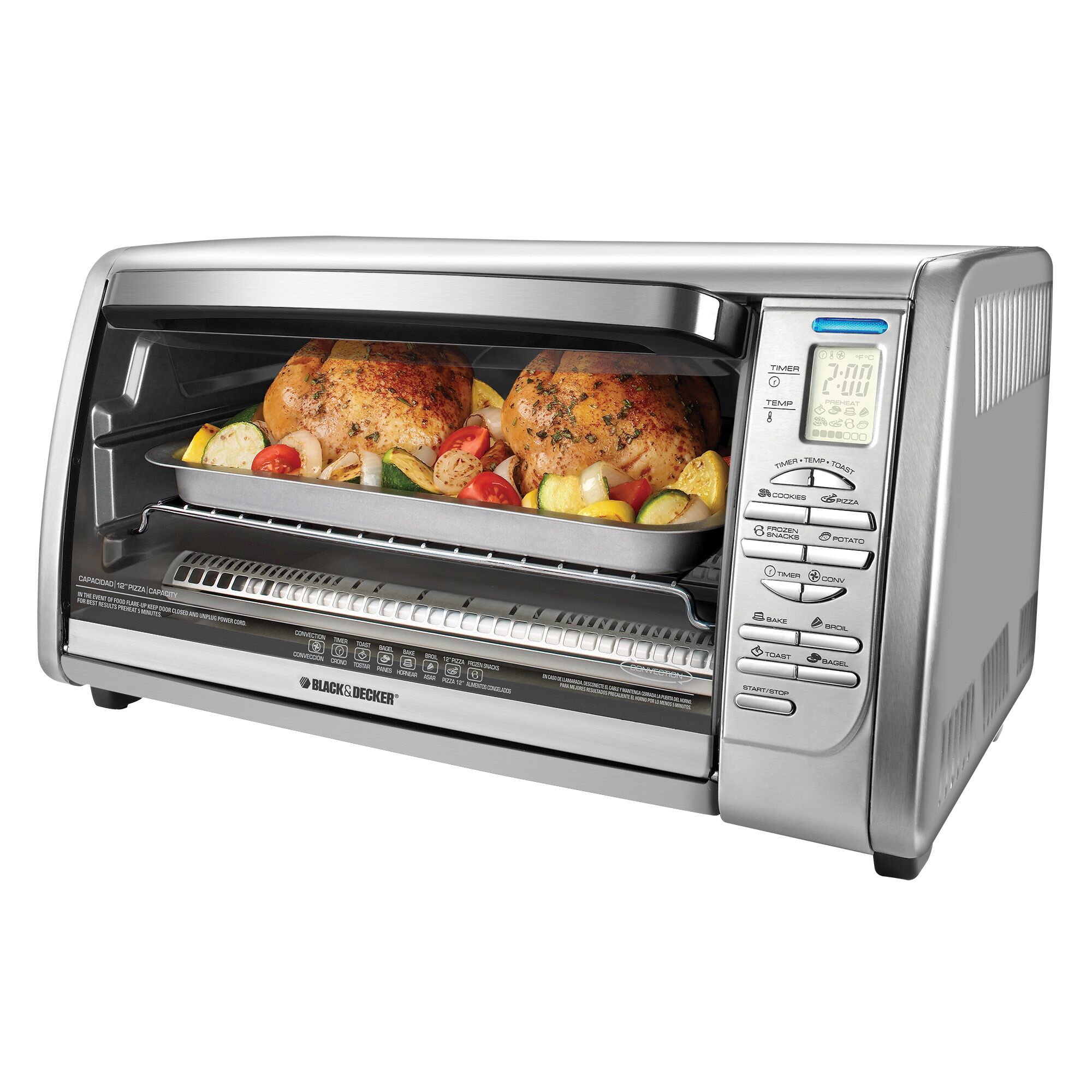 Profile of countertop convection toaster oven with baked chicken and vegetables.
