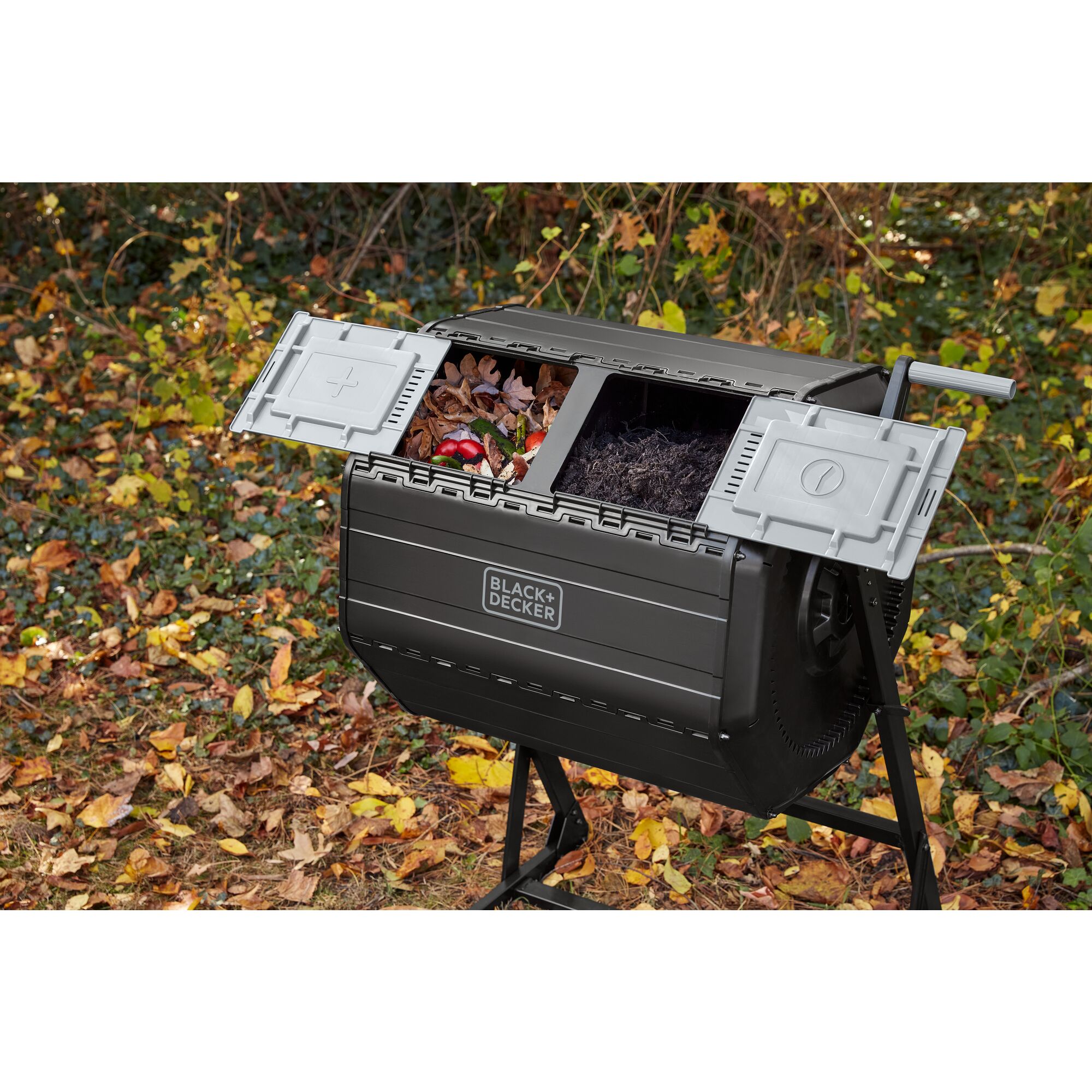 BLACK+DECKER Tumbler Composter with sliding doors open, with pre-compost in the left chamber and final compost in the right