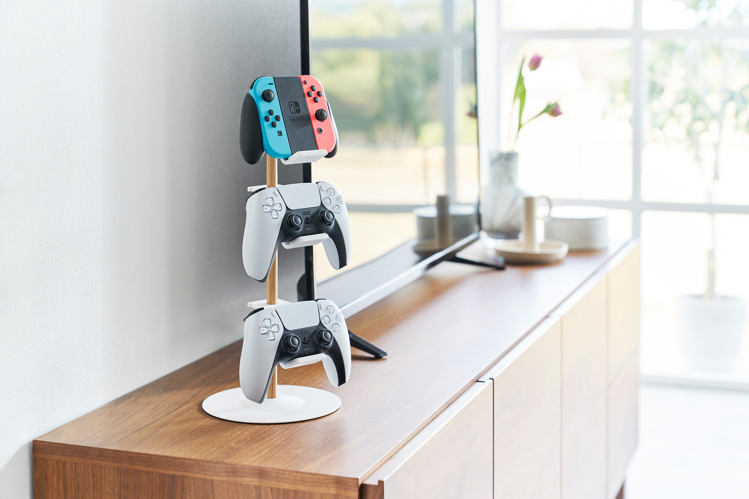 White Yamazaki Home Controller Stand with controllers displayed