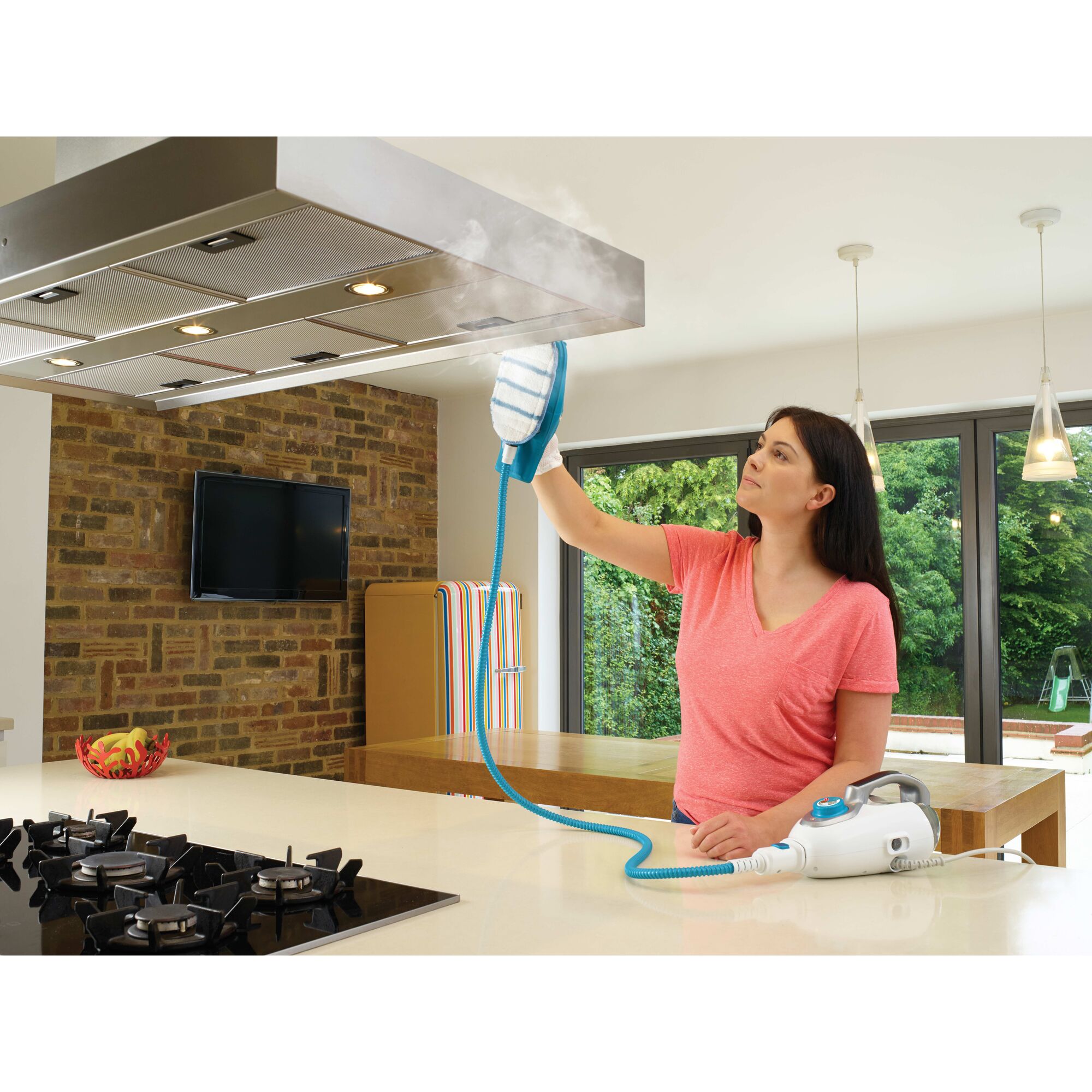 7 in 1 Steam Mop with steamglove handheld steamer being used to clean stovetop vent.