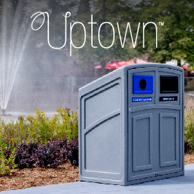 durable LDPE plastic outdoor double stream recycling and waste bin with sloped lid and front hinged door sitting in a city park