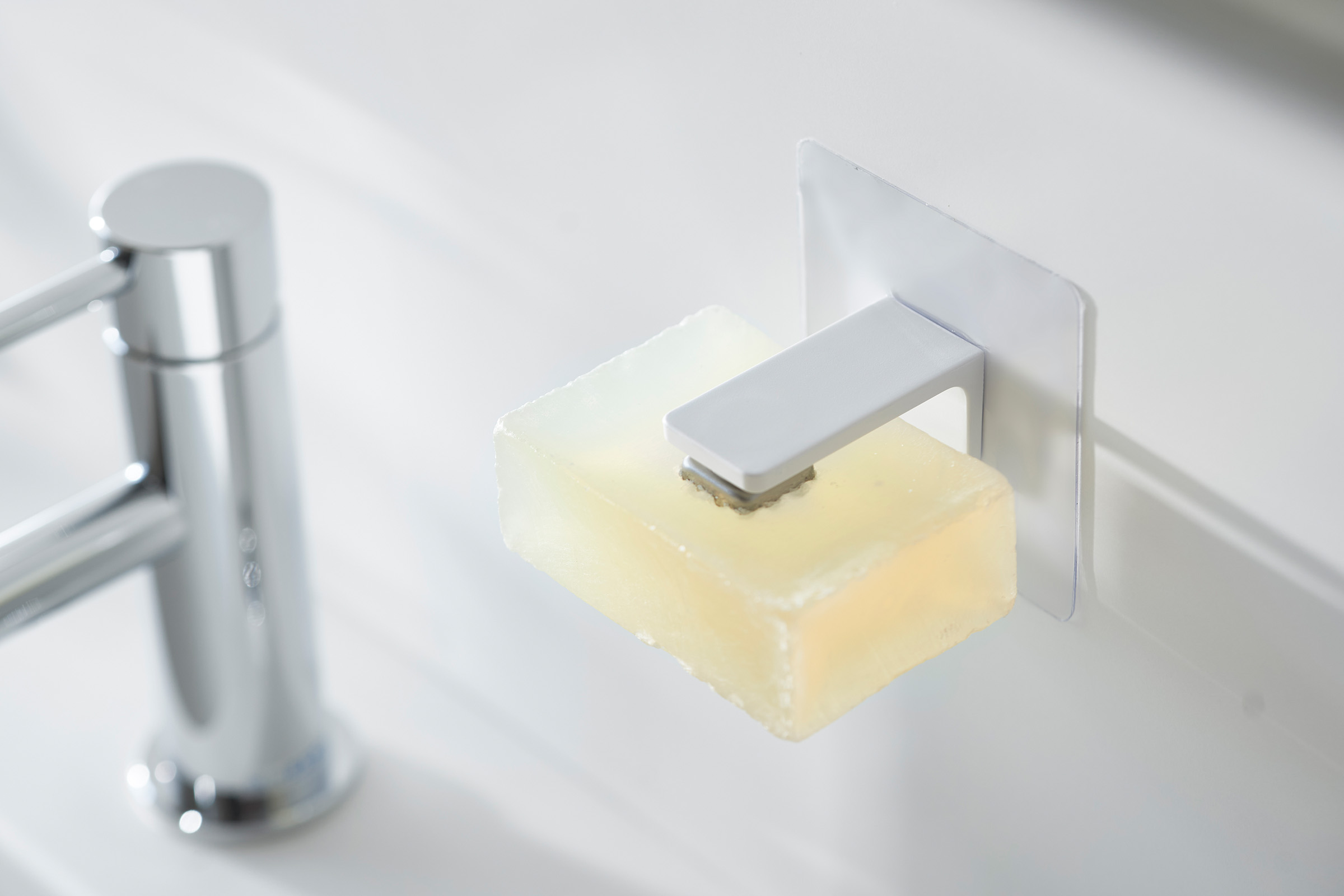 White Yamazaki Home Magnetic Soap Holder installed next to sink