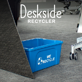 blue deskside recycling container with we recycle stamped on the bin sitting under a modern office desk