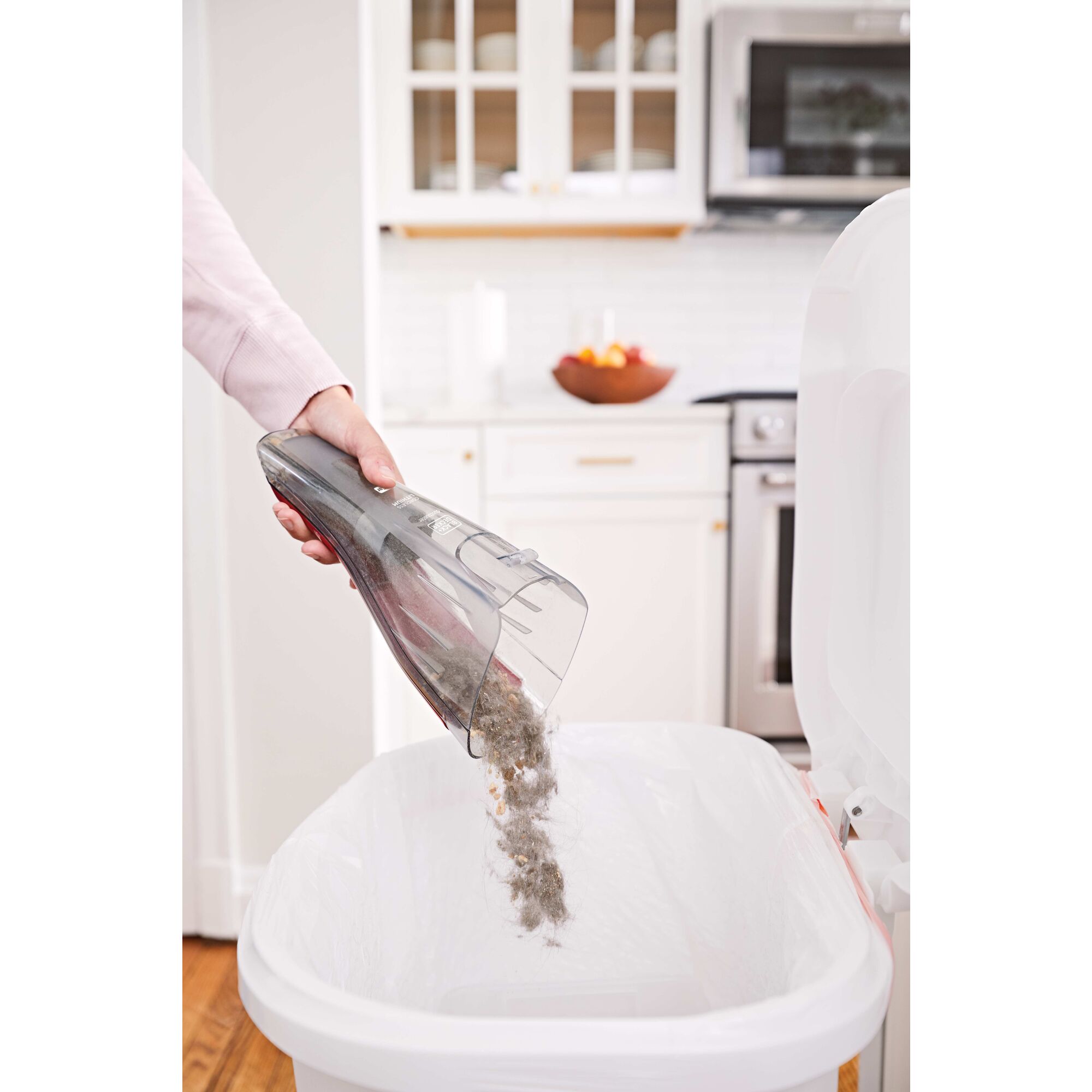 Clear bagless dirt bowl for easy cleaning feature of Dustbuster QuickClean Car Cordless Hand Vacuum With Motorized Upholstery Brush.