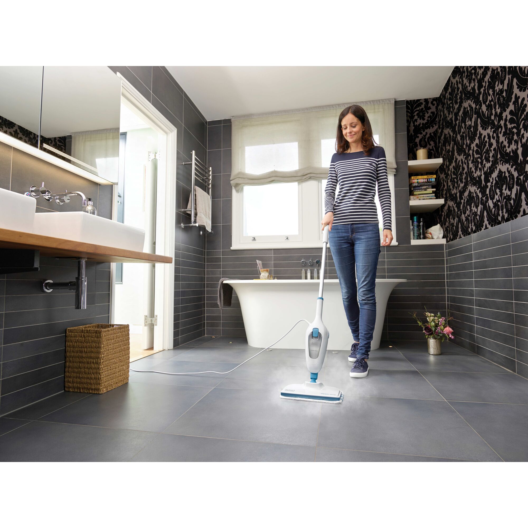 Classic Steam Mop being used by a person to clean bathroom floor.