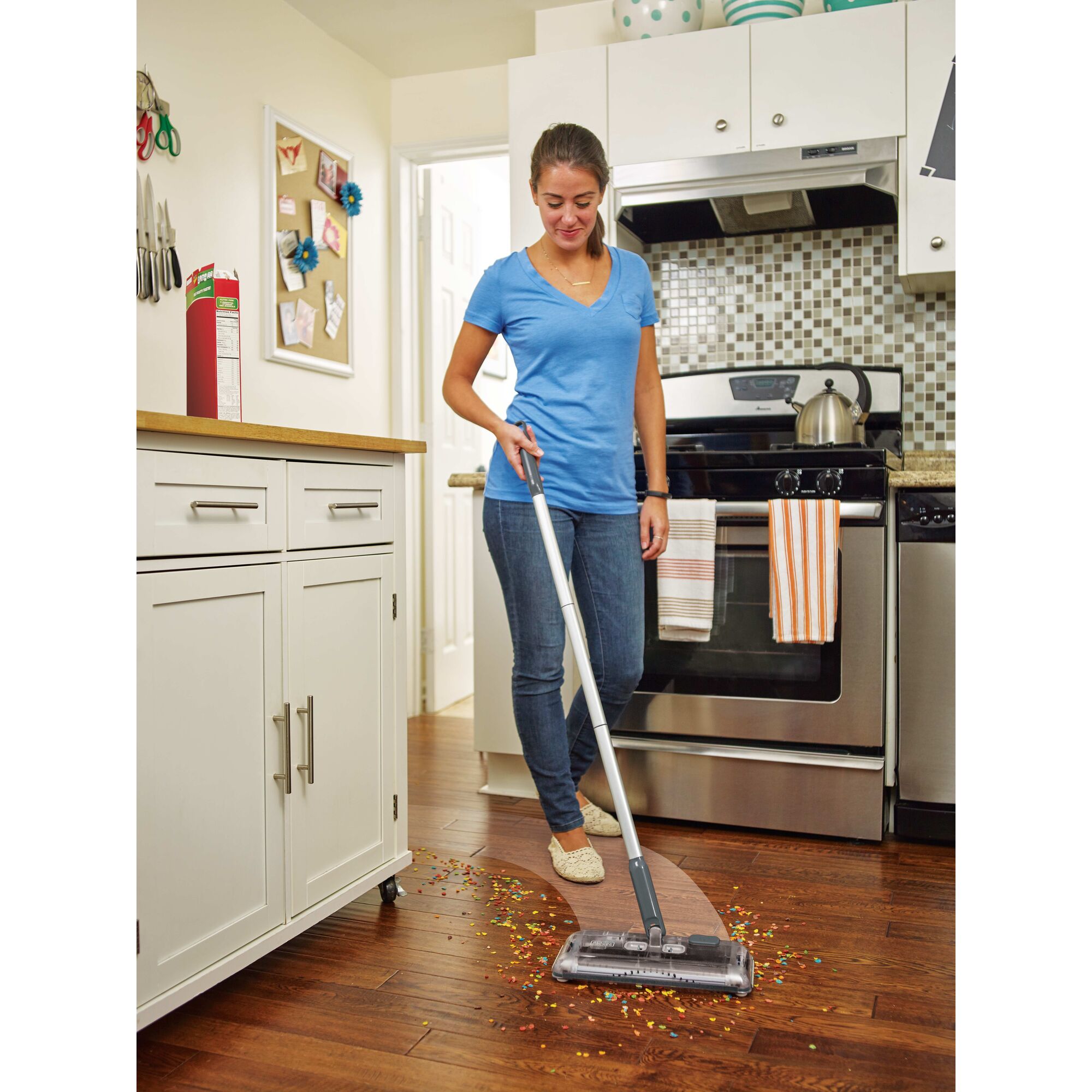 100 Minute Powered Floor Sweeper being used for cleaning mess on floor by person.