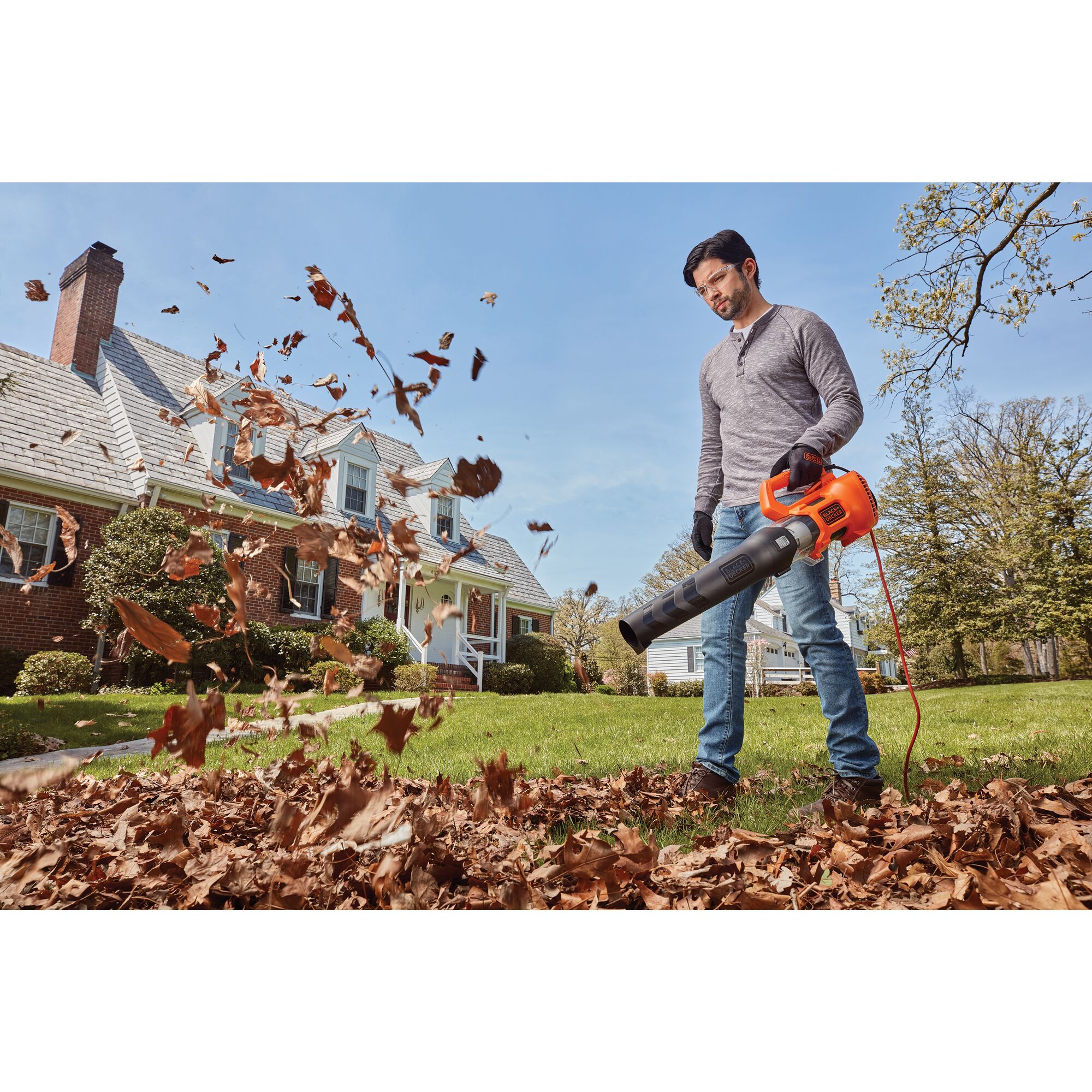 9 ampere electric axial leaf blower being used by a person.