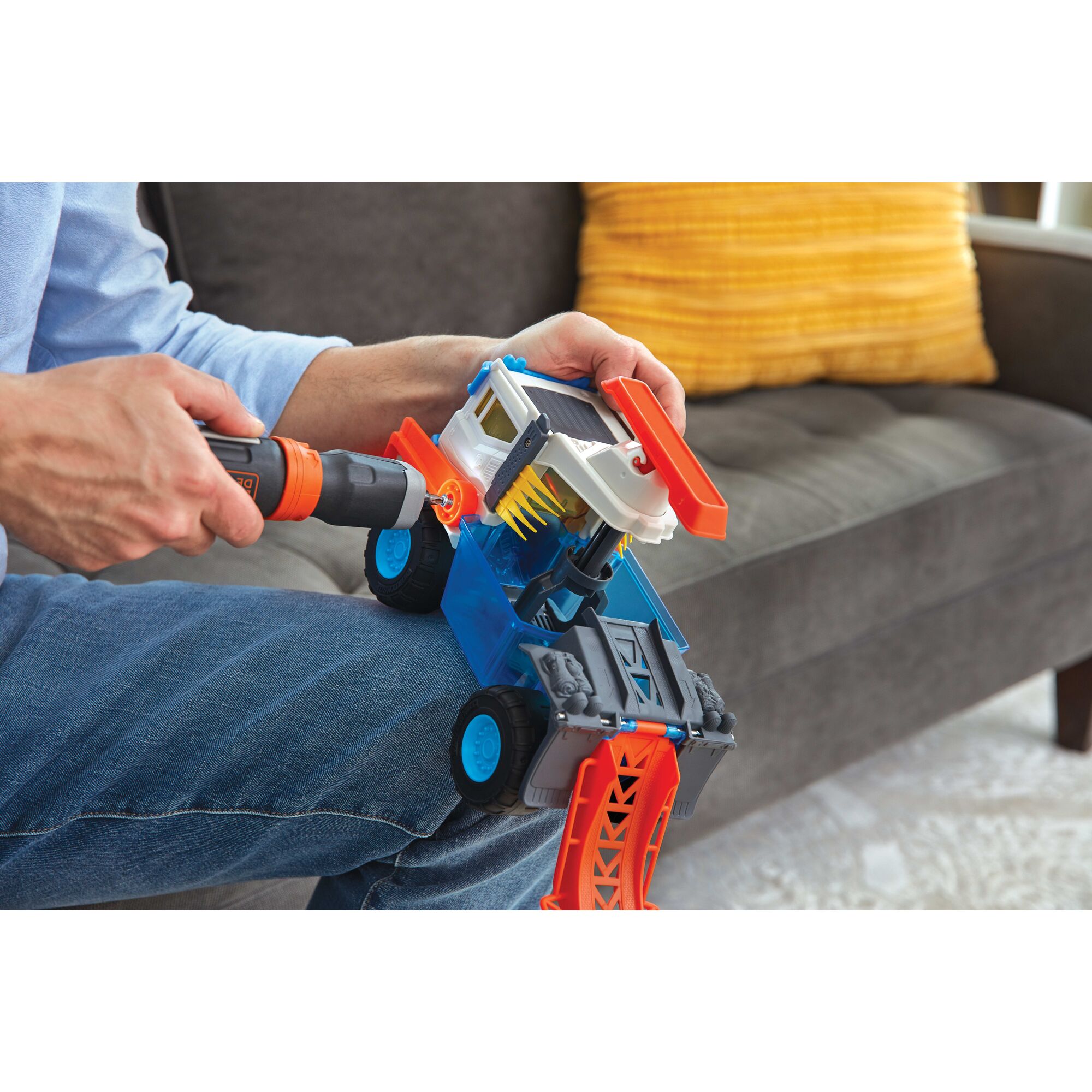 Cordless Power Driver Screwdriver with Extension Shaft being used for fixing toy.