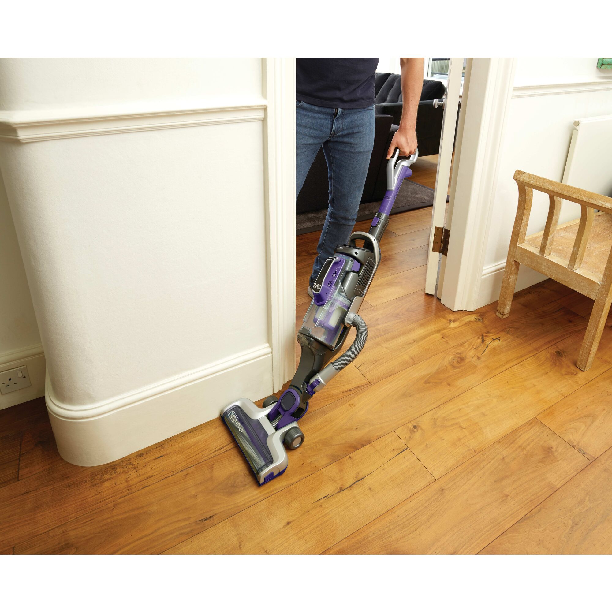 POWERSERIES PRO Cordless 2 in 1 Pet Vacuum being used to clean floor by a person.