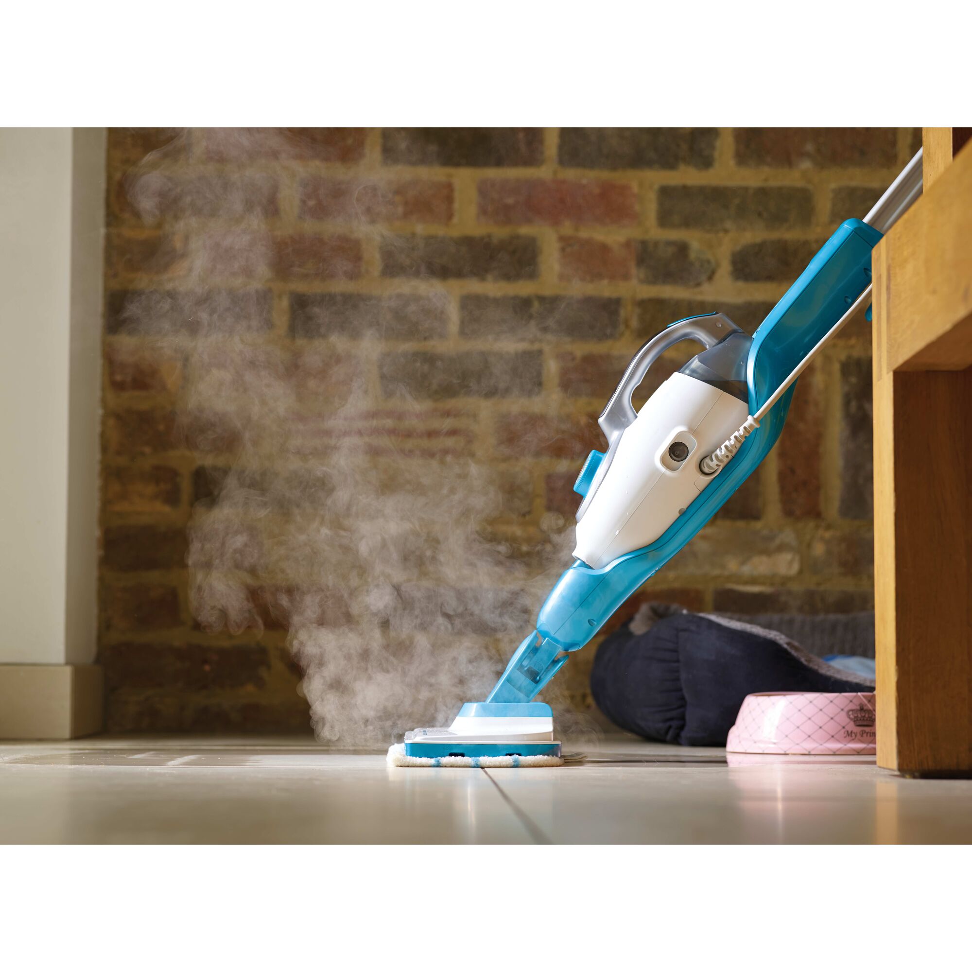 7 in 1 Steam Mop with steamglove handheld steamer being used to clean floor.