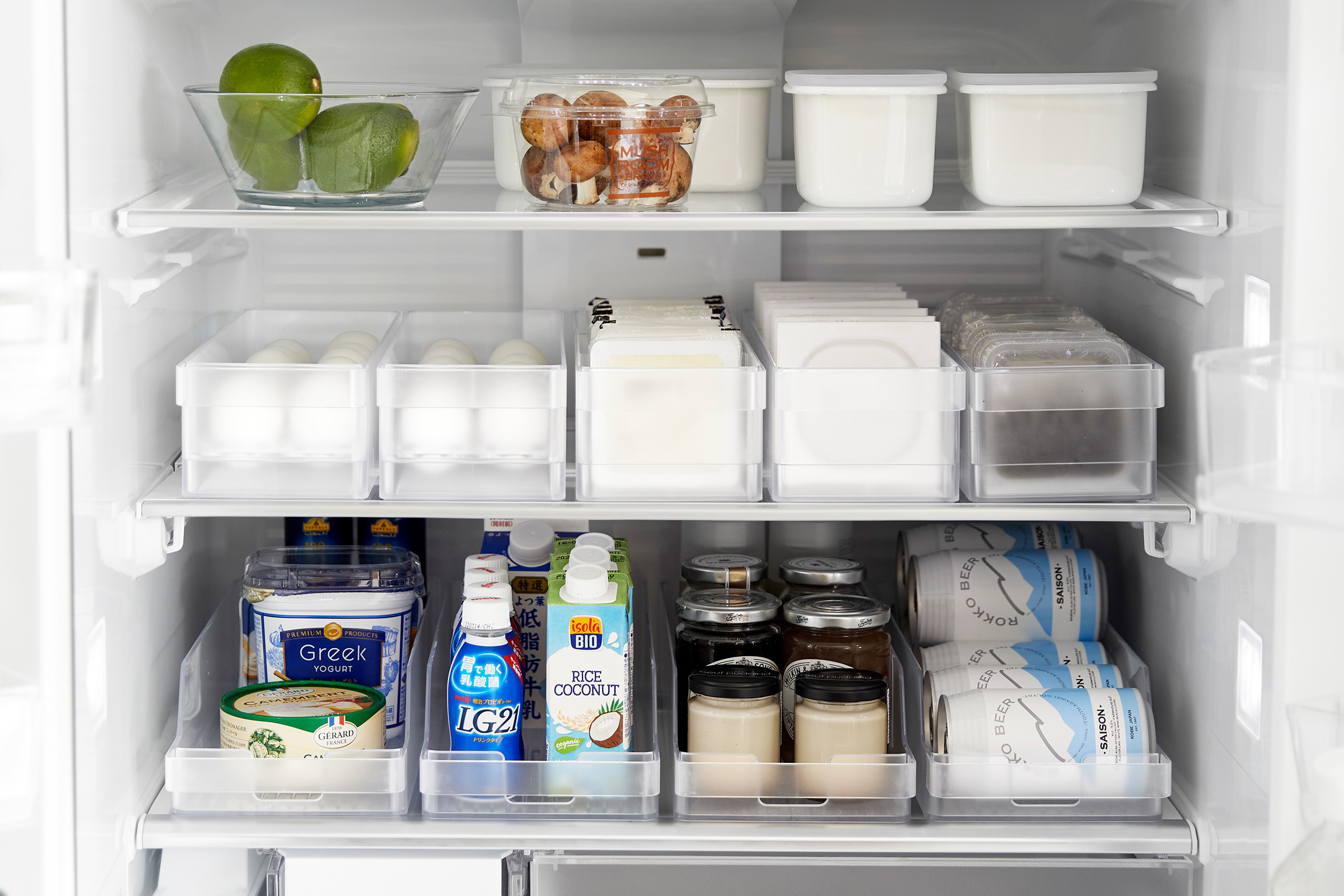 Full frontal view of Yamazaki Refrigerator Organizer Bins full of food inside a refrigerator