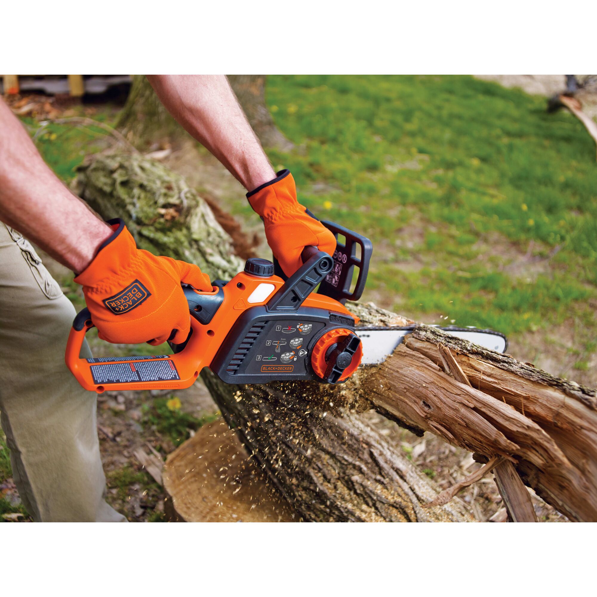 Lithium 12 inch Chainsaw being used for cutting tree bark.
