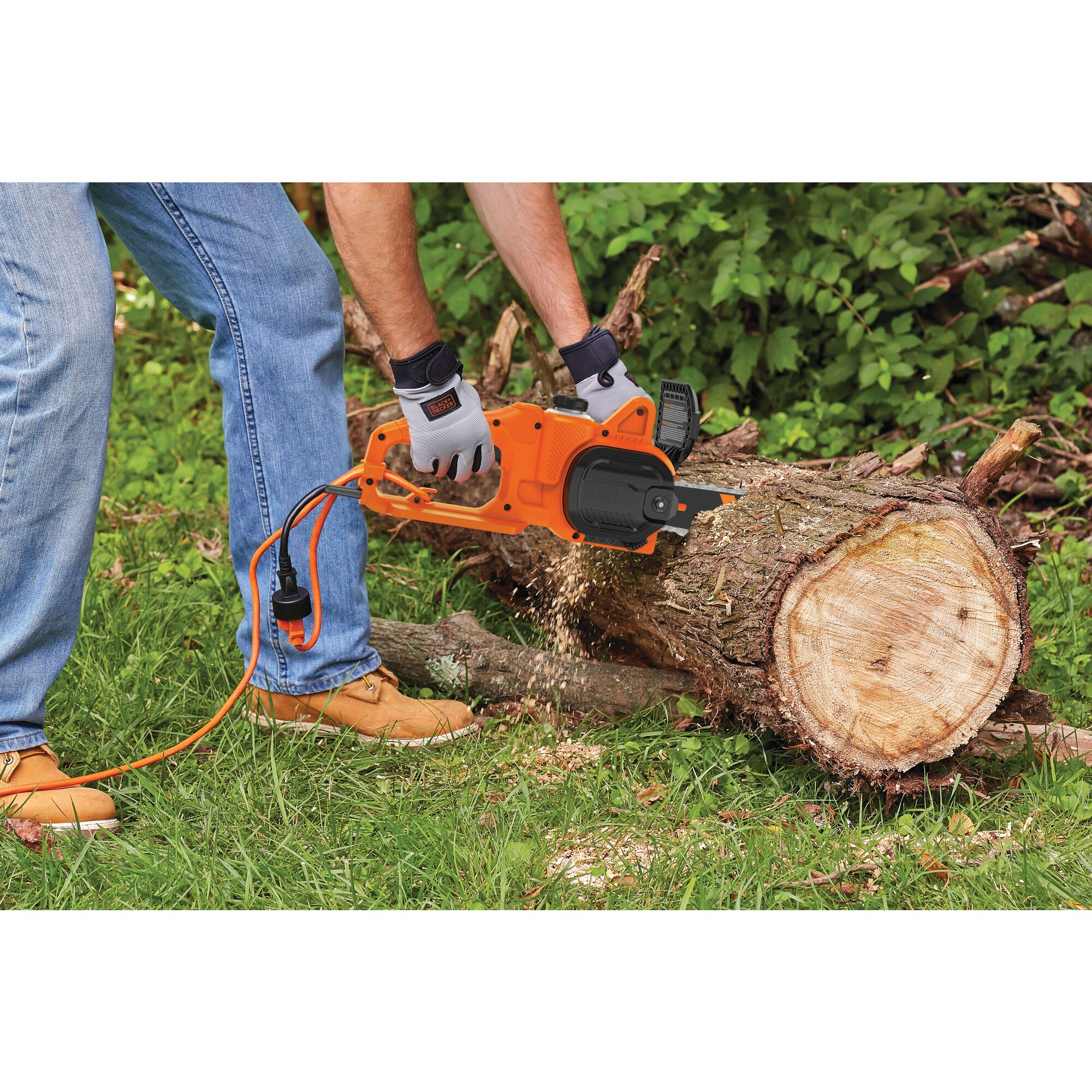 8 Amp 14 inch Electric Chainsaw being used for cutting tree trunk.