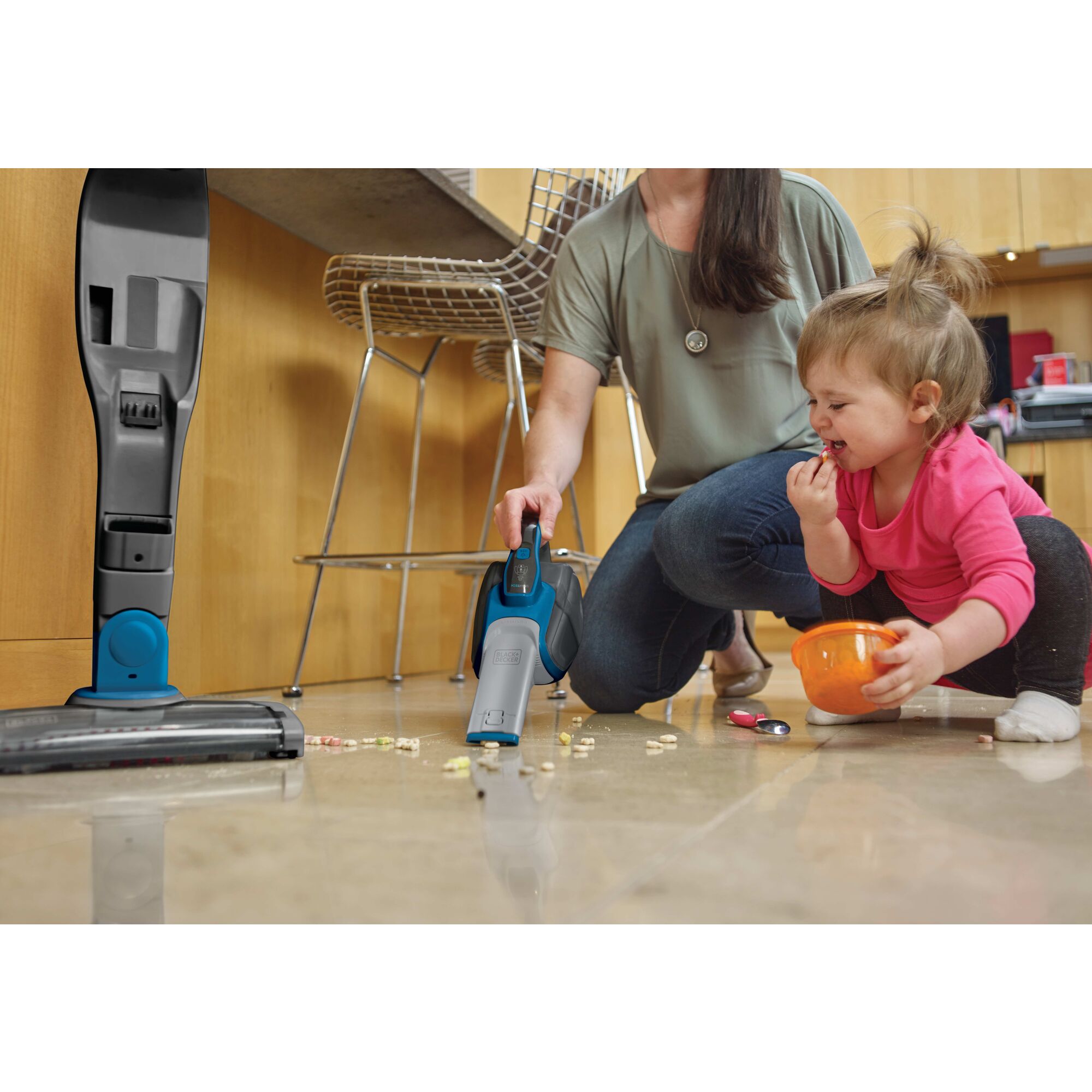 Cordless Lithium 2 in 1 Stick Vacuum being used for cleaning baby food mess by hand held vacuum.