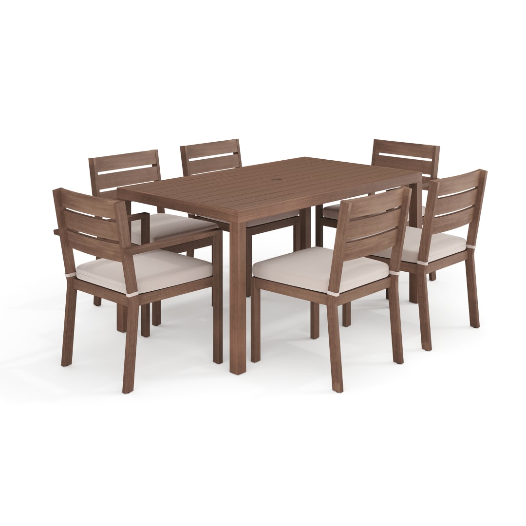 Bedford Indoor-Outdoor Patio Set with 62" Table and 6 Dining Chairs with Brown Brushed Woodgrain Aluminum Finish and Cream All-Weather Seat Cushions