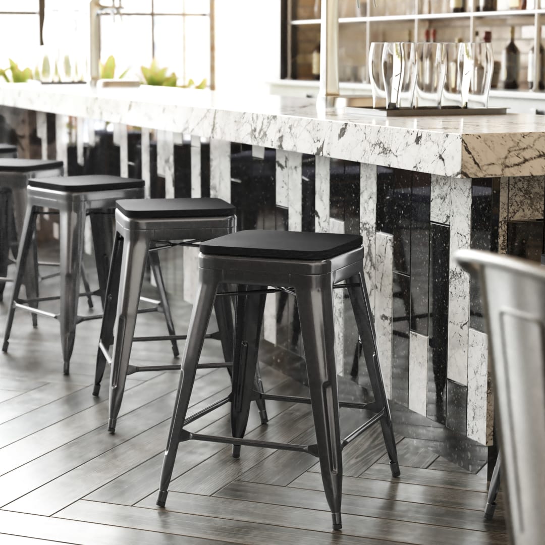 Cierra Set of 4 Commercial Grade 24" High Backless Black Metal Indoor Counter Height Stools with Black All-Weather Poly Resin Seats