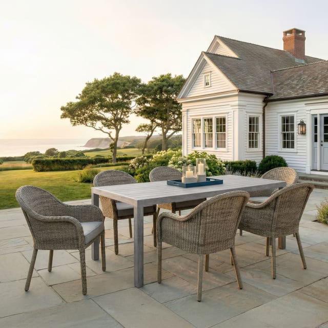 Bedford 7 Piece Patio Set, 6 Stacking Weathered Gray Rattan Wicker Chairs, Gray Cushions, 71 Inch Rectangular Gray Brushed Woodgrain Aluminum Table