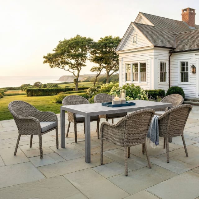 Bedford 7 Piece Patio Set, 6 Stacking Weathered Gray Rattan Wicker Chairs, Gray Cushions, 62 Inch Rectangular Gray Brushed Woodgrain Aluminum Table