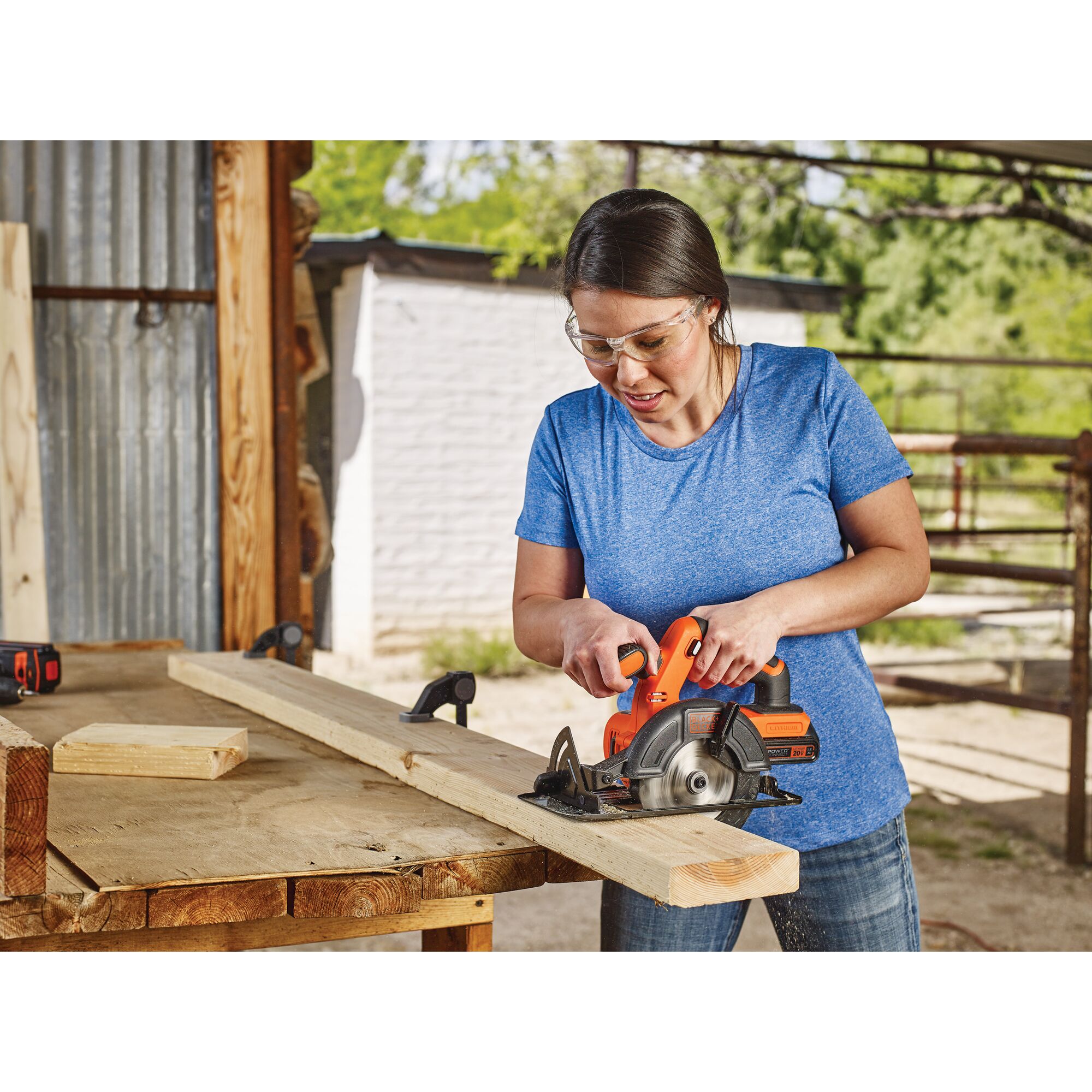 Person using a 5 and half Inch Cordless Circular Saw being used for cutting wood.