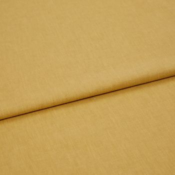 Mustard-yellow woven fabric panel, folded once with a visible overlapping edge, lying flat and smooth; close-up, studio-lit view emphasizing fine textile texture and warm, even lighting.