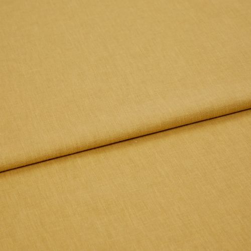 Mustard-yellow woven fabric panel, folded once with a visible overlapping edge, lying flat and smooth; close-up, studio-lit view emphasizing fine textile texture and warm, even lighting.