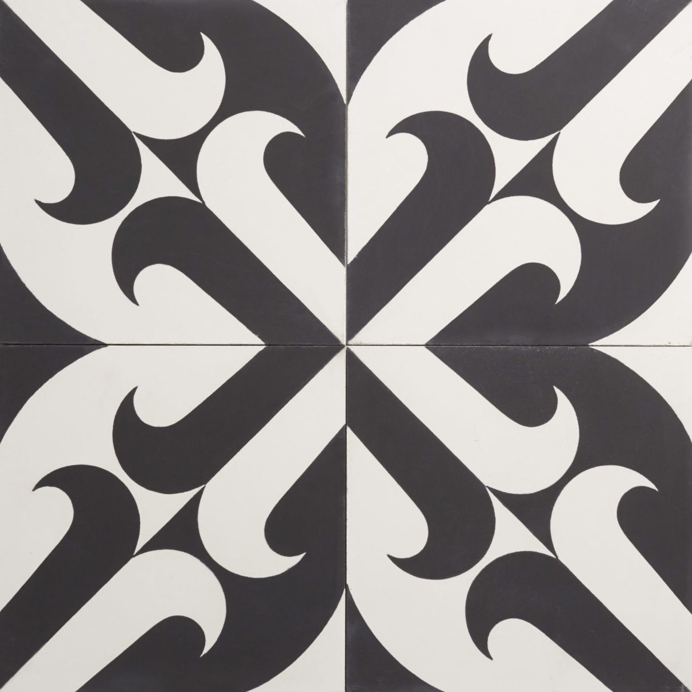 four black and white tile with a design on them.