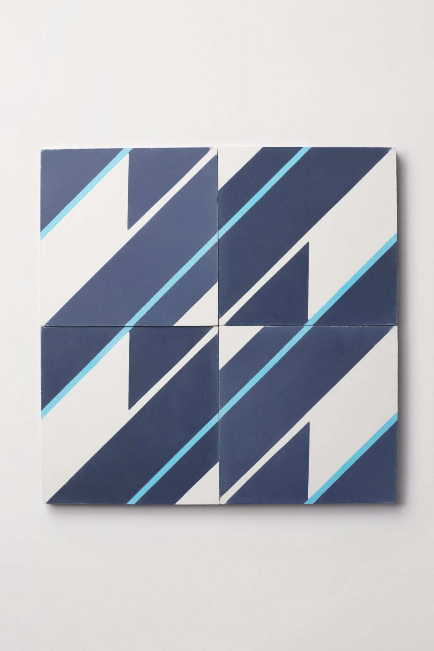 four tiles with blue and white stripes on them.