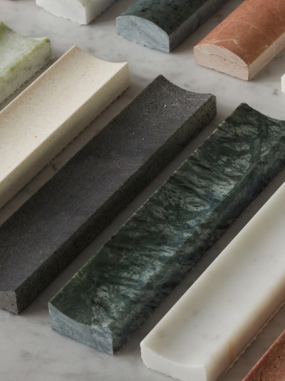 a row of different colored marble slabs on a marble table.