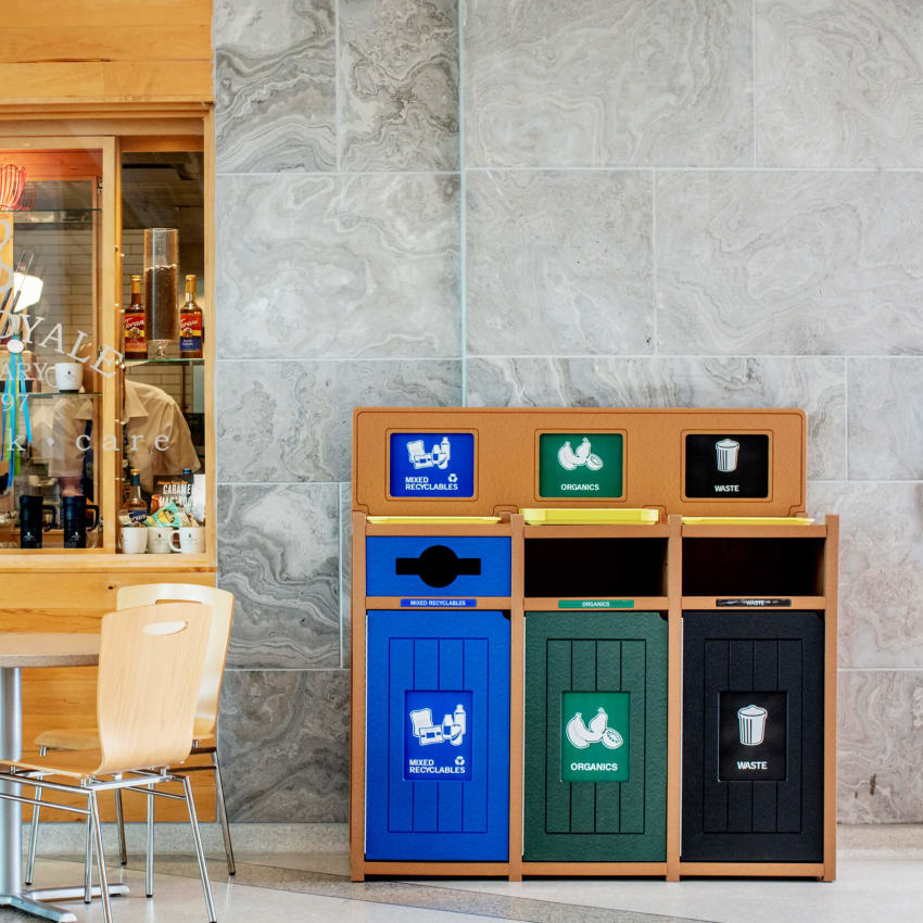 triple recycling organics and waste bin in a hospital food court