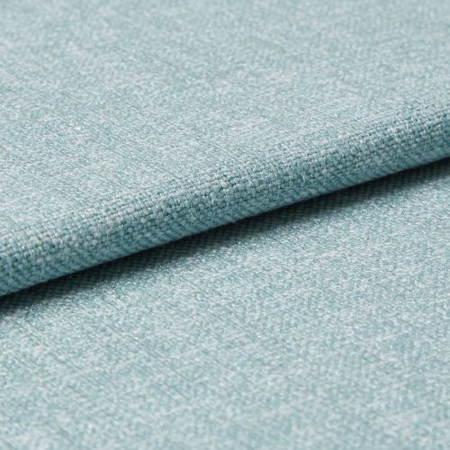 Light-blue woven upholstery fabric folded so one edge overlaps, revealing tight textured weave; photographed as a close-up on a flat surface with soft, even studio lighting for a material sample.