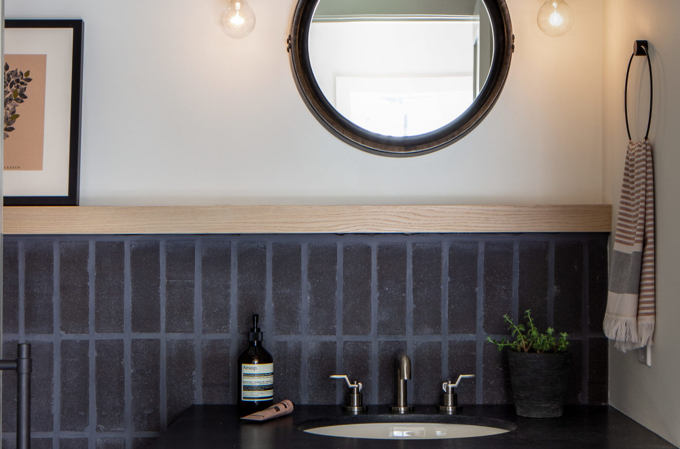 a bathroom with a sink and a mirror.