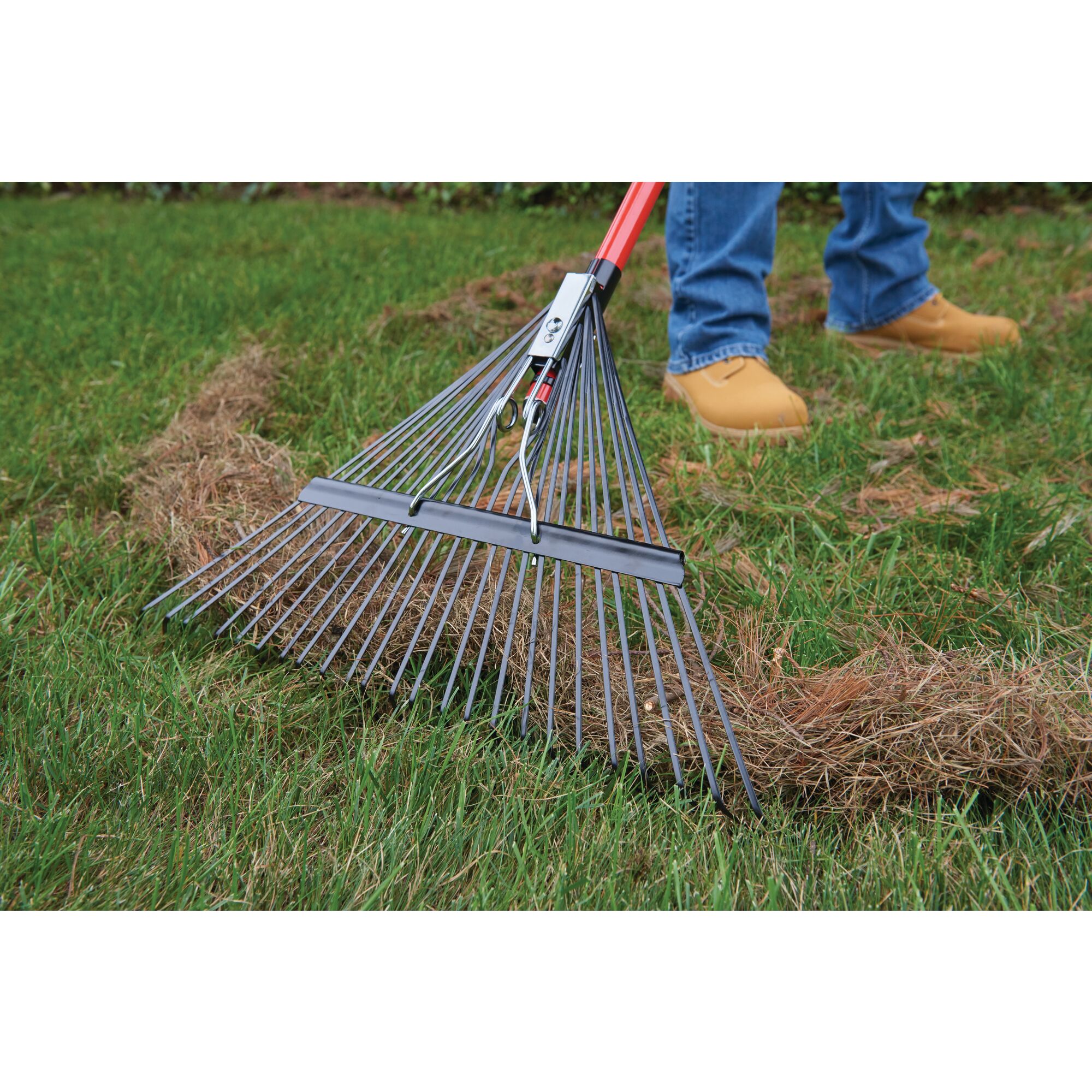 24 inch tine fiberglass handle lawn rake being used.
