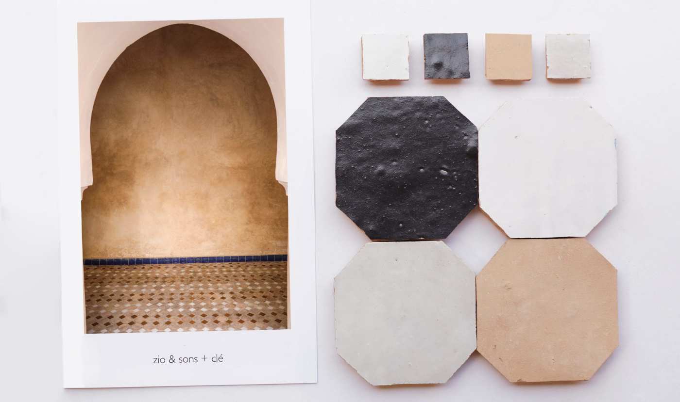 a collection of tiles and a book on a table.