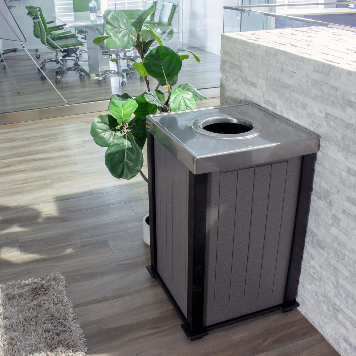grey recycling container with a circle opening stainless steel lid for collection cans and bottles in an office