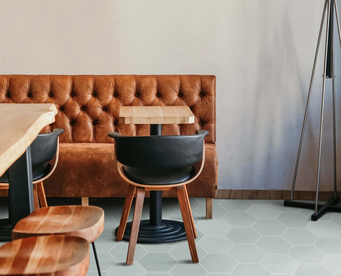 a tiled floor in a restaurant with a wooden table and chairs.